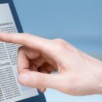 photodune 2473776 businessman using touch screen device m e1438752887201 كيف تعمل شاشات اللمس؟ مجلة نقطة العلمية