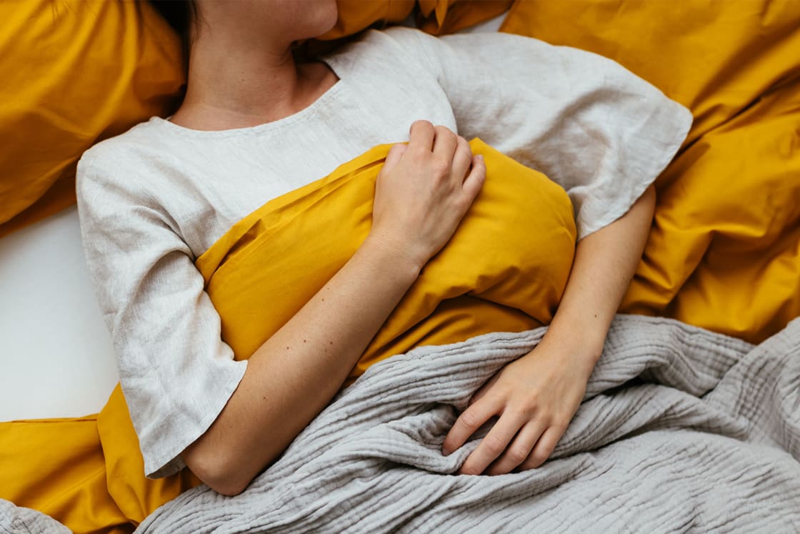 Unrecognizable Woman Sleeping In Bed At Home مجلة نقطة العلمية