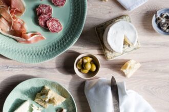 a european inspired lunch of baguette cheese charcuterie olives and anchovies هذه الأسماك الصغيرة هي أهم غذاء لصحة الدماغ! مجلة نقطة العلمية
